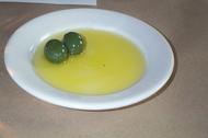 olives-in-olive-oil-on-white-recessed-plate