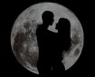 couple-silhouette-in-front-of-moon
