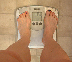 weight-scale-with-woman-on-itweight-scale-with-woman-on-it