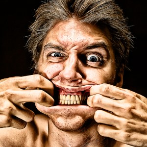 man-playing-with-his-face-needs-socialization