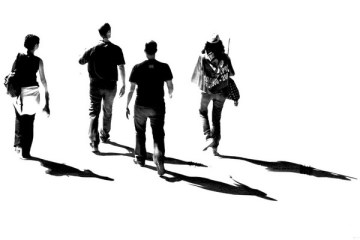 walking-together-four-friends-with-their-shadows-in-black-and-white-exercise-social