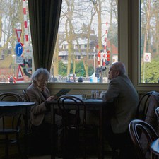 elderly-couple-eating-at-restaurant