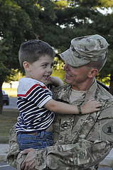 troop-being-welcomed-home-joyously-by-his son
