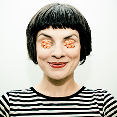 female-posing-with-walnuts-for-eyes-she-is-NUTS