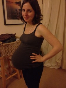 smiling-pregnant-woman-showing-fetal-bump-requires-more-nutrients-for-fetus